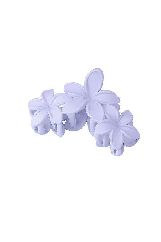 Haarclip in zachte lila kleur, versierd met een delicate bloem voor een romantische en speelse uitstraling.